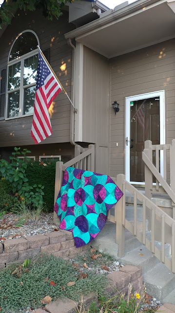 Fizzy block modern quilt using purple and teal Island Batik fabrics
