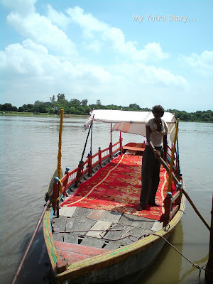A Boatman waits for customers at the Yamuna River Ghat, Mathura