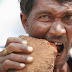 Indian man is obsessed to eating bricks (Video)