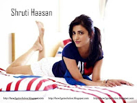 shruti haasan hot, lying on bed in blue top and white short with bare feets