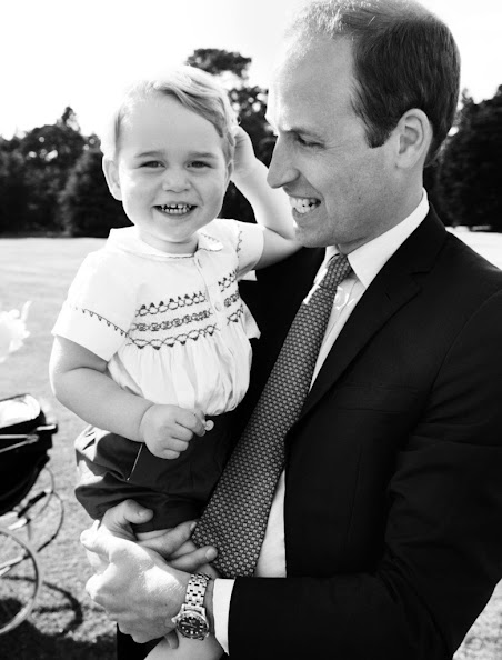 Prince William, Duke of Cambridge and his son Prince George of Cambridge pose for a photo after the christening of Princess Charlotte of Cambridge at the Sandringham Estate on July 5, 2015 in King's Lynn, England.