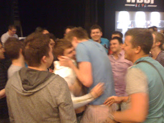Hugs for Oleksii Kovalchuk, winner of Event No. 42 at the 2012 WSOP