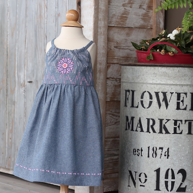 New Look 6293 in Sewing Studio's chambray embellished with embroidery designs and floating stitches