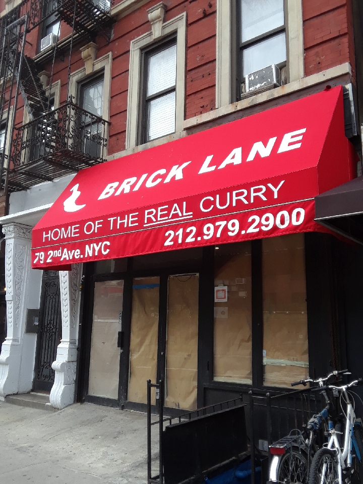EV Grieve Brick Lane Curry House announces itself with fiery red awning at new 2nd Avenue location