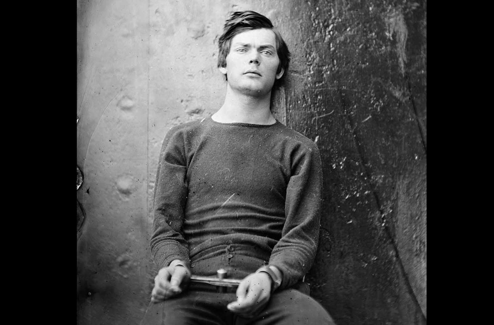 Conspirator Lewis Powell (Payne), in a sweater, seated and manacled in the Washington Navy Yard, Washington D.C. in April of 1865. Powell attempted unsuccessfully to assassinate United States Secretary of State William H. Seward in his home on April 14, 1865. he was soon caught, and became one of four people hanged for the Lincoln assassination conspiracy.