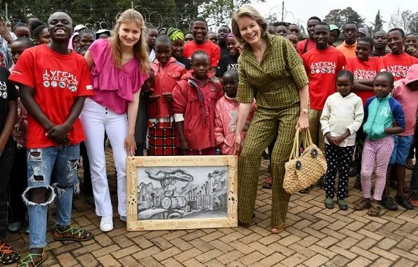 Queen Mathilde Dries Van Noten jacket and trousers, Natan dress, Crown Princess Elizabeth in Maje blouse and white trousers