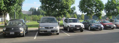 Parking lot full of cars that are backed into their spots