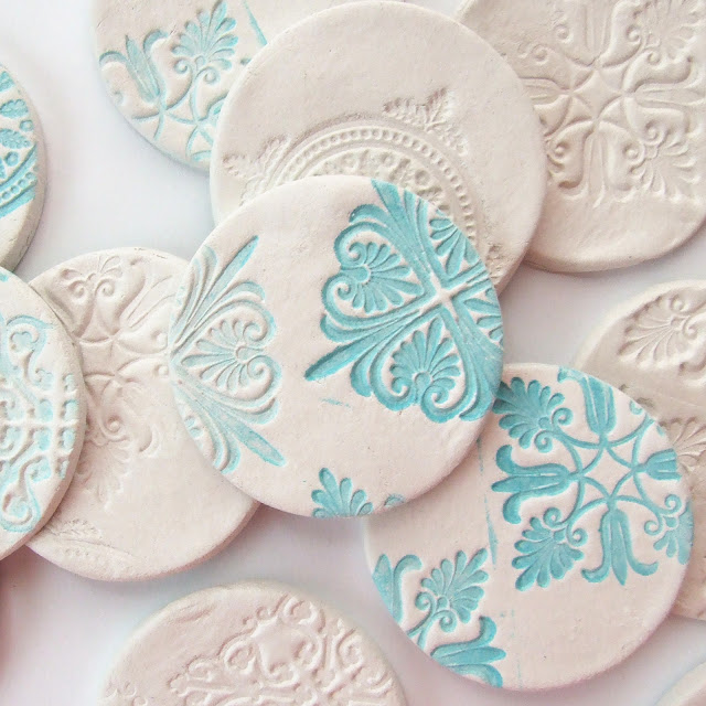 Stamped clay magnets sq