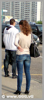 Girl in jeans on the bus station