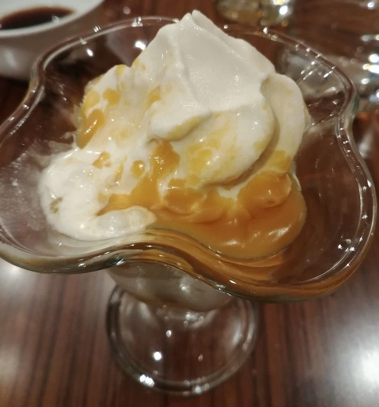 Vanilla ice cream with caramel sauce at the dessert station of The Grand Kitchen