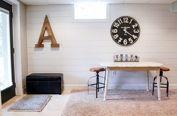 A gorgeous new plank wall brightens and totally transforms a previously, boring basement. - Littleouseoffour.com