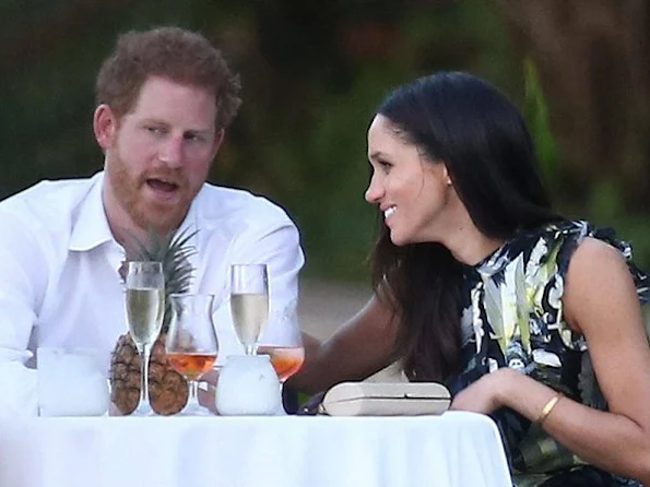 Prince Harry went to Jamaica in order to attend the wedding ceremony of the couple Tom Inskip and Lara Hughes-Young. Meghan Markle wore a bird printed silk maxi dress by Erdem Pre fall 2017 collection