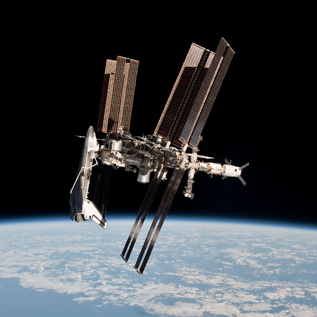 First portrait of Shuttle and ISS taken from a Soyuz spacecraft