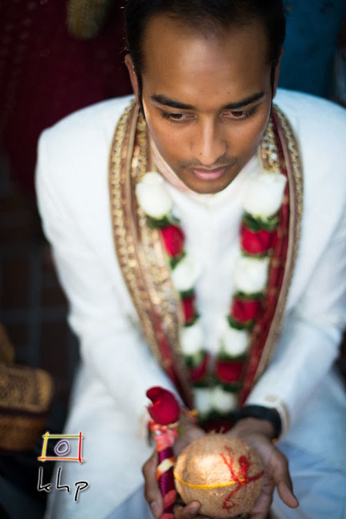 Mehul holding the coconut (for luck) during the Barat