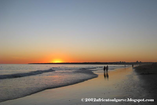 romantic walk on Galé beach at sunset