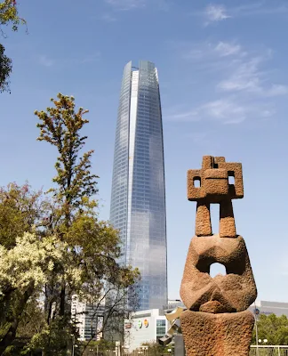 Sculpture and a skyscraper in Santiago Chile