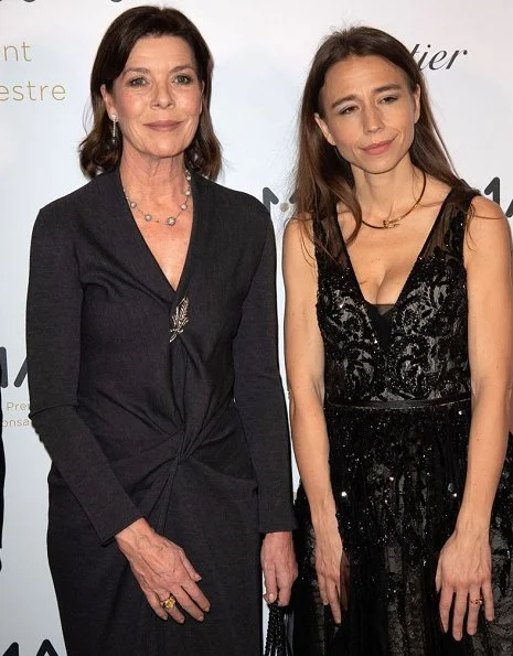 The Princess attend a party at Le Grand Hotel in Paris. Princess Caroline of Monaco wore a gray maxi dress by Prada