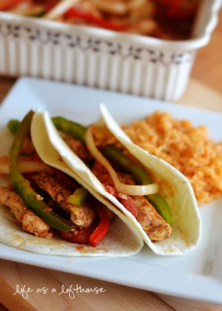 Oven Baked Chicken Fajitas are filled with flavorful chicken, onion, tomatoes and red and green bell peppers. Life-in-the-Lofthouse.com
