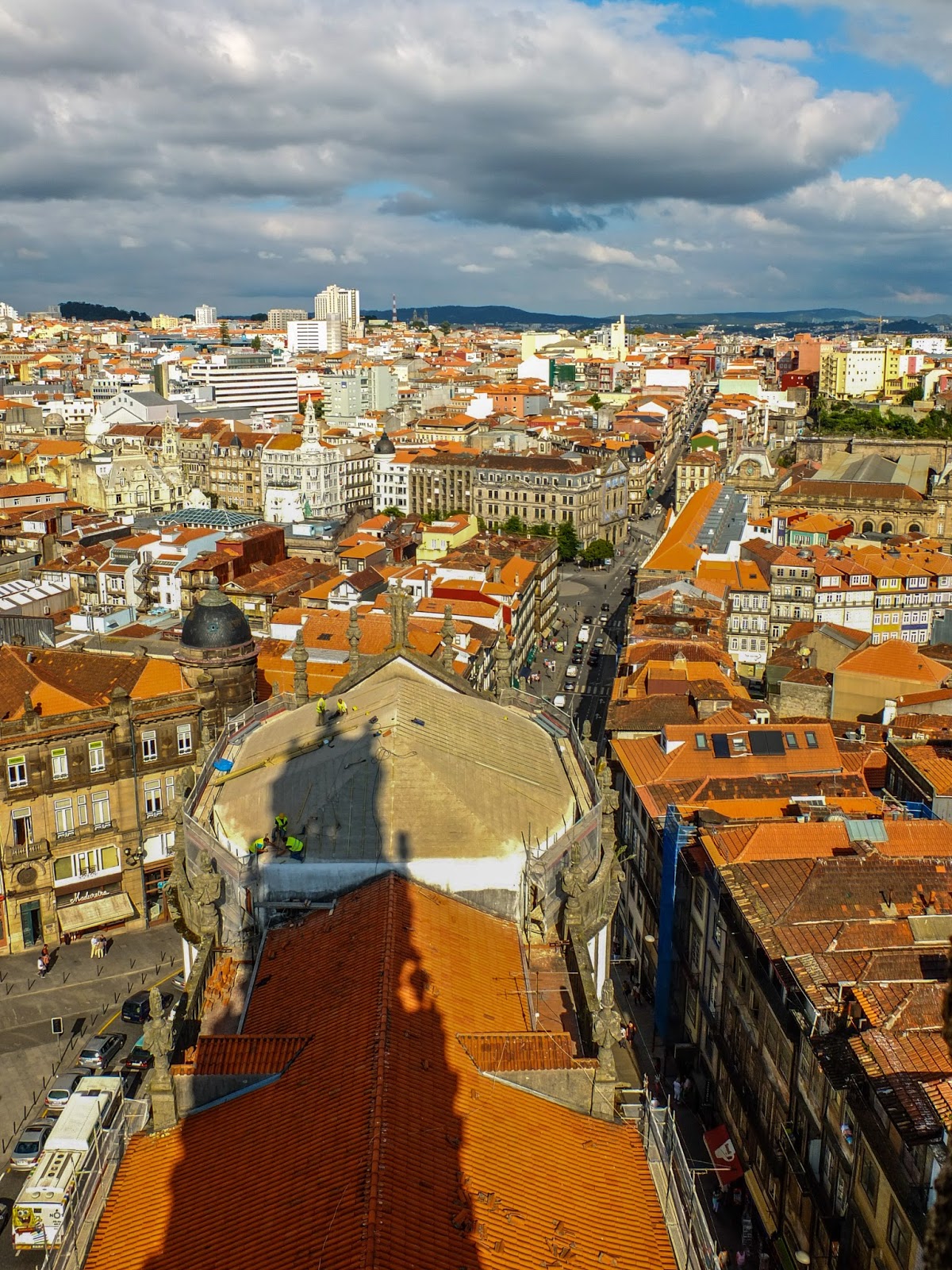 View from the Clerigos tower with its own shadow in Porto, Portugal.