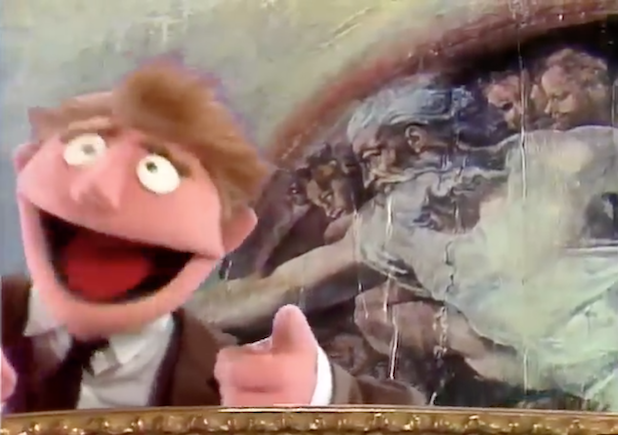 ''How did Michelangelo paint Jim Henson’s likeness on the ceiling of the Sistine Chapel more than 400 years before he was born?
NO. ONE. KNOWS!'' Muppet of normal fella in suit against background showing God with flowing hair and beard from Michelangelo's 'Creation of Adam'