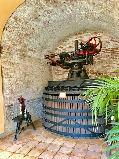 Antique wine press at Contratto. Photo credit: Nicole Ruiz Hudson.