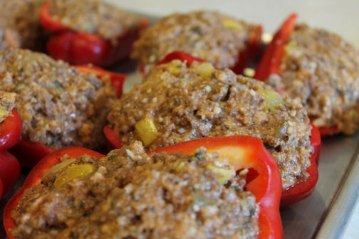 A pan of spicy Italian stuffed peppers ready to freeze or bake.