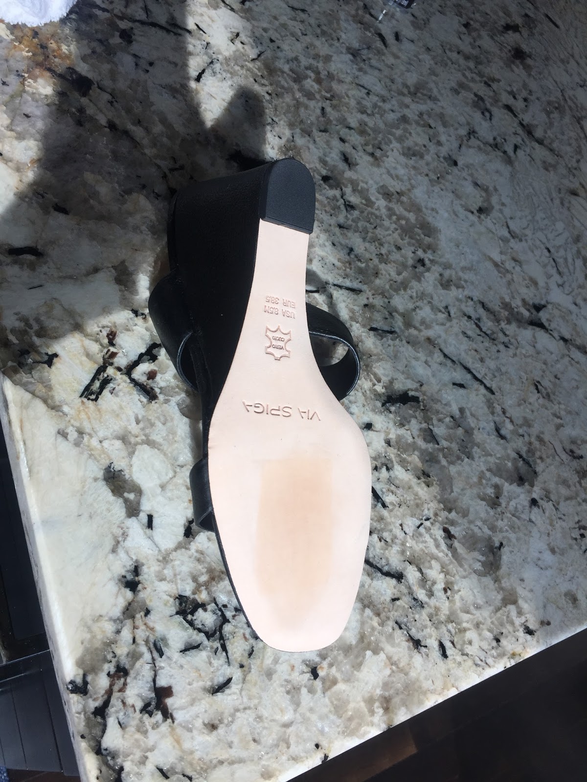 Muckety Mucked Before and After Removing Sales Sticker from Shoes