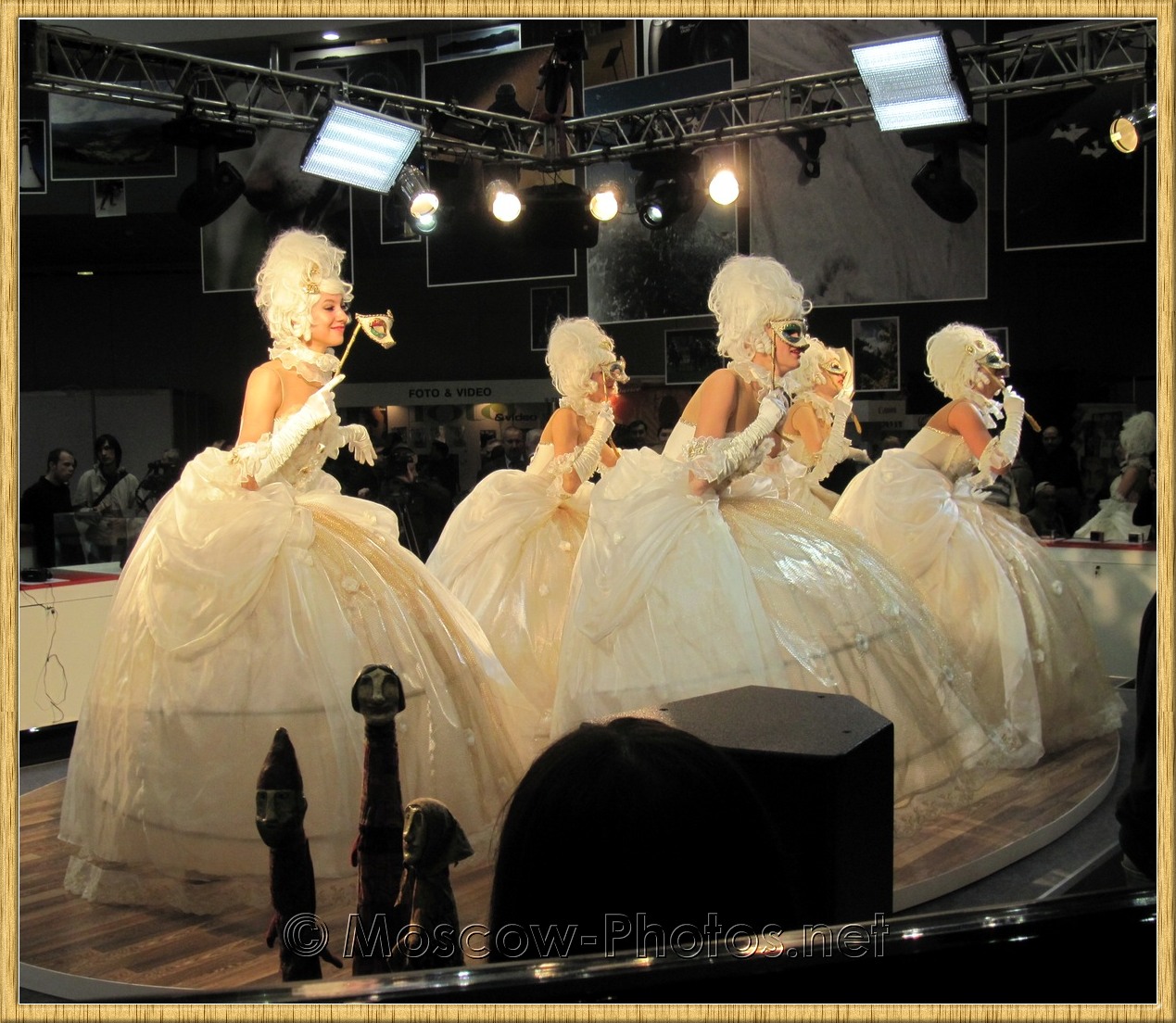Dancing girls in white ball gowns at Photoforum 2010