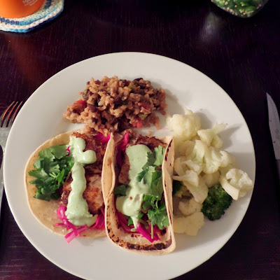 Cinnamon Spice Fish Tacos:  White fish fillet coated with a spicy cayenne cinnamon spice mix, wrapped in a corn tortilla and topped with cool cabbage and creamy avocado sauce.
