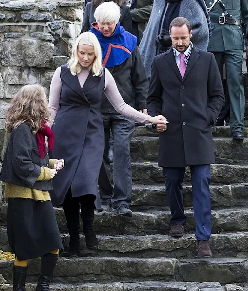 Crown Princess Mette Marit wore Valentino Cape, Prada wool sweater, Prada Boots, diamond earrings