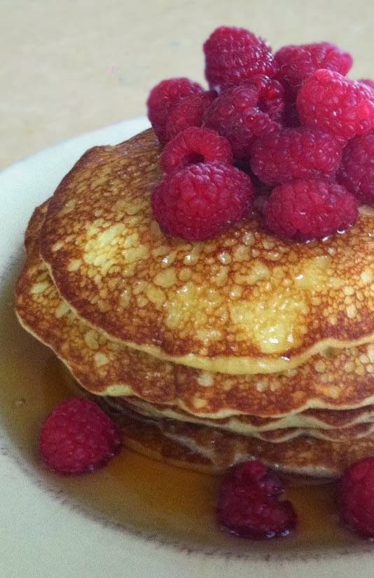 Pancakes Topped w/ Raspberries and Syrup