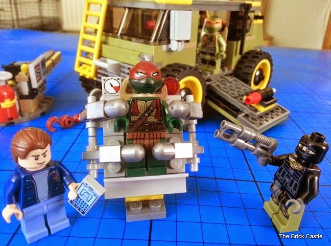 LEGO TMNT Turtle Van Takedown Set 79115 Review scene turtle imprisoned in stretcher 
