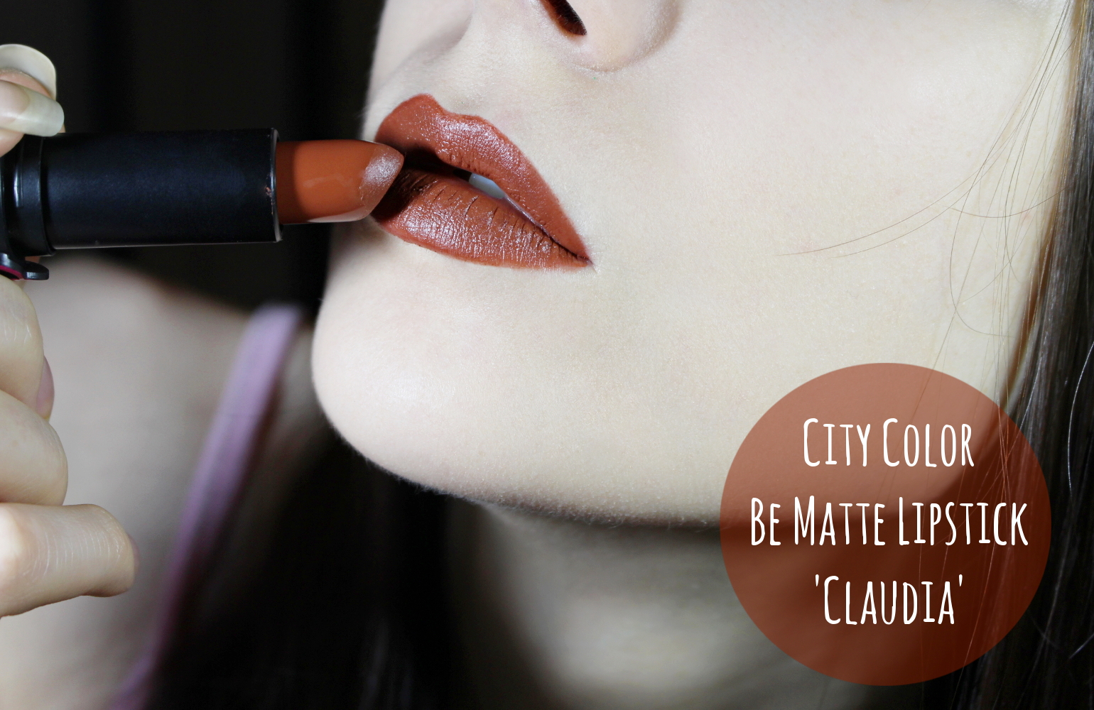 Liz Breygel demonstrates stunning matte lipstick in shade Claudia on her lips