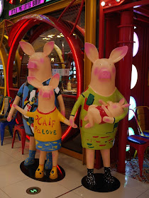 humanoid pig family statues at the Mudanjiang Wanda Plaza