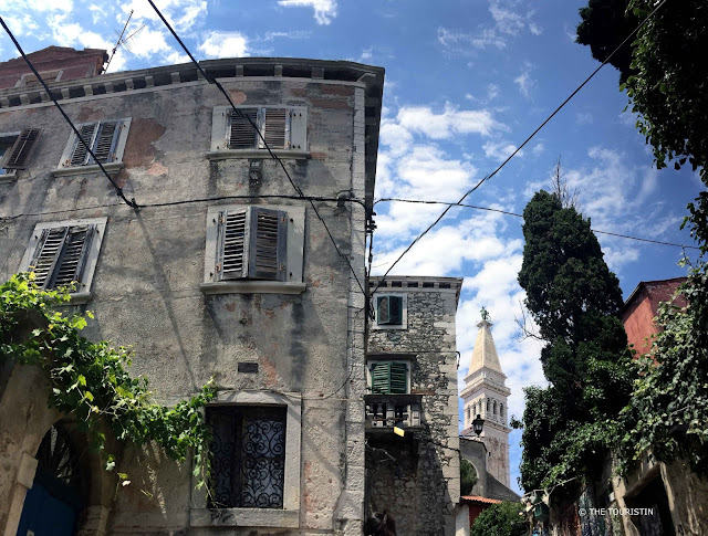 Rovinj, Croatia, Europe, old town. Church, blue door, wines, sky
