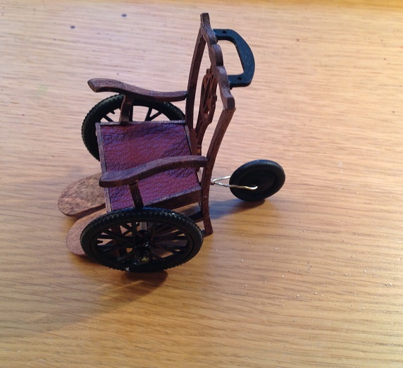 Dollhouse escapes Miniature wheelchair
