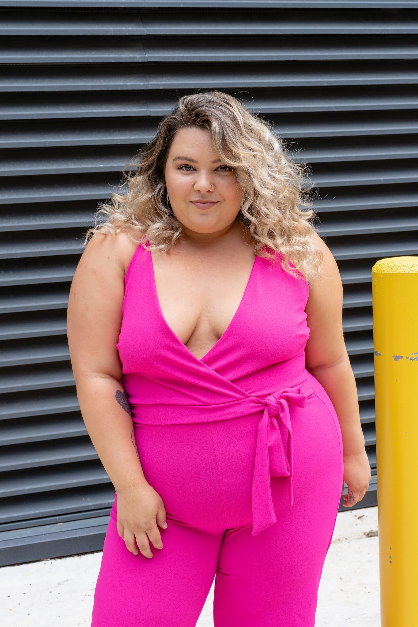 Chicago Plus Size Petite Fashion Blogger reviews a Fashion Nova Curve Jumpsuit and talks about embracing her lower tummy and curves.