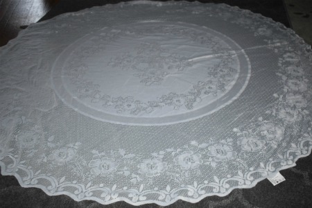 Laced table linen re-purposed as an outdoor table cloth