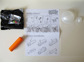 I DO 3D pens and pen tips in packets, an instruction sheets, plastic forms and a spotlight.