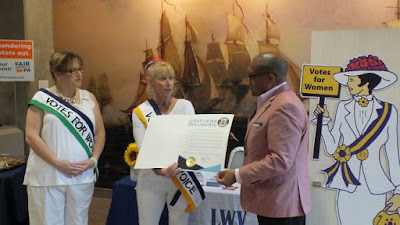 Erie County government representative presents proclamation to two members of League of Women Voters Erie County government representative presents proclamation to two members of League of Women Voters
