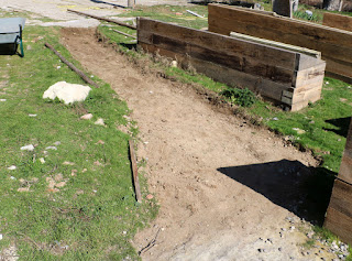The path has been dug out; now to put sand and stones down The path has been dug out; now to put sand and stones down