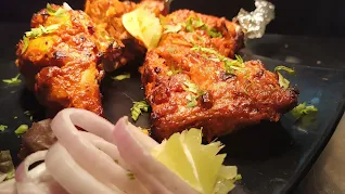 Garnished Tandoori chicken pieces for Tandoori chicken recipe