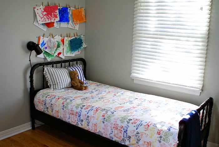 Salvaged black Jenny Lind style bed in boy's bedroom