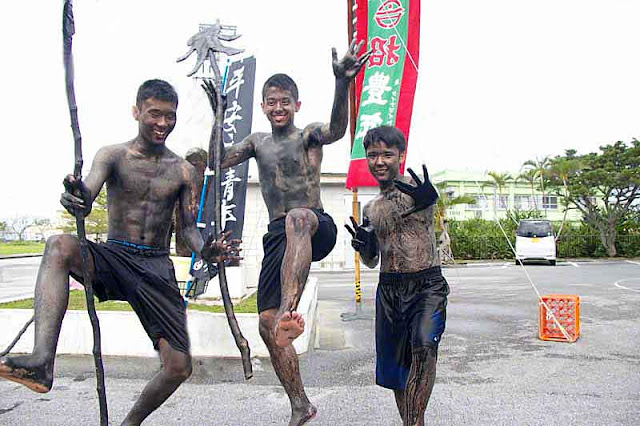 3 young men, blackened bodies, active pose