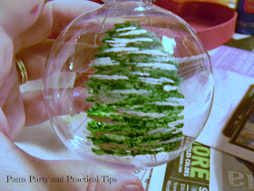 Adding the snow to a painted Christmas tree ornament 