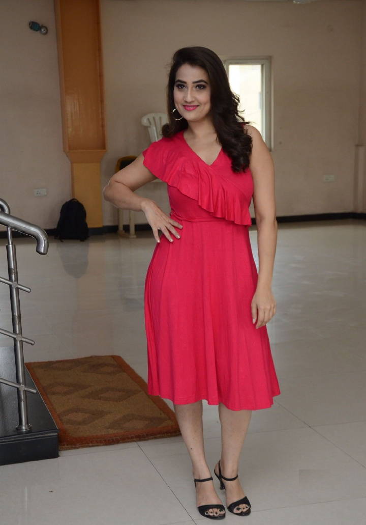 Glamorous Indian TV Model Manjusha Hot Long Cross Legs Stills In Red Dress