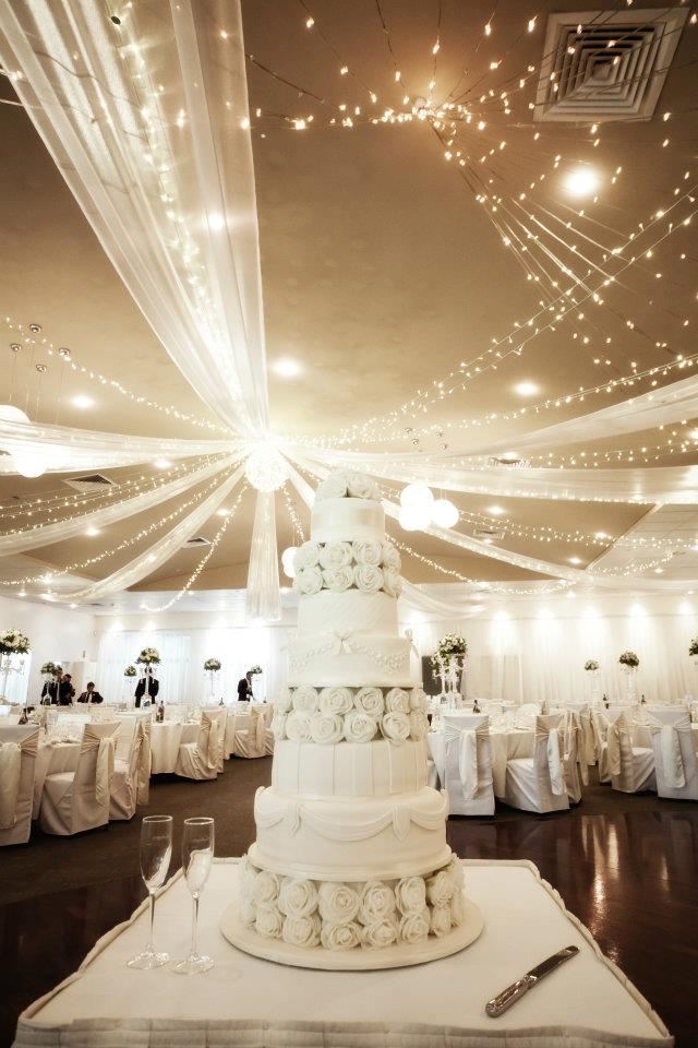 The elegant and intricately crafted 8 tier wedding cake was created by the 