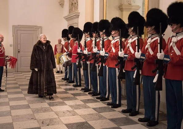 Crown Prince Frederik and Crown Princess Mary attended New Year reception. Princess Mary wore satin skirt