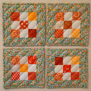 scrappy quilted potholders: QuiltBee