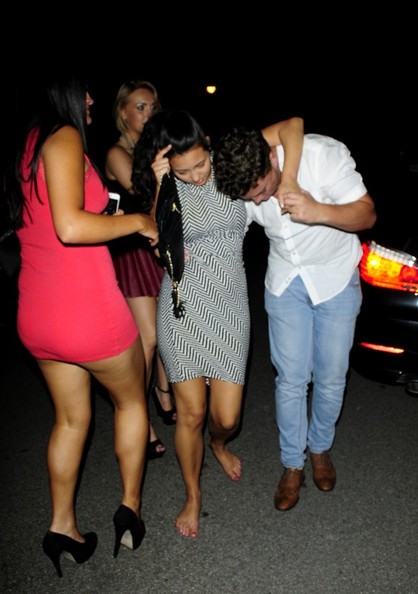 More very drunk girls photographed in the street after leaving parties, pub...
